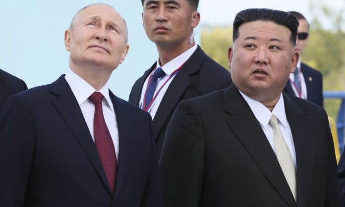 1468172-kim-putin.jpg