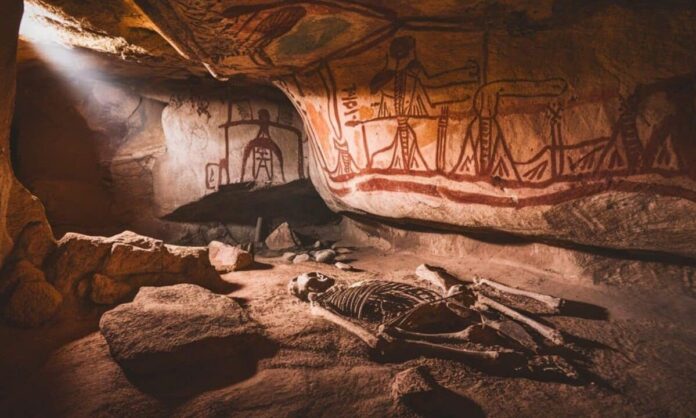 1633257-ec0702b9-an-ancient-cave-with-walls-adorned-with-intricate-rock-paintings-1200x727.jpg
