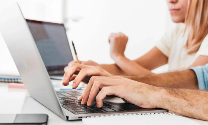 1636049-008bf7b2-crop-hands-typing-laptop-workplace.jpg