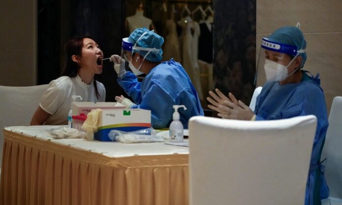 1654961-a7a19371-covid-19-china.jpg