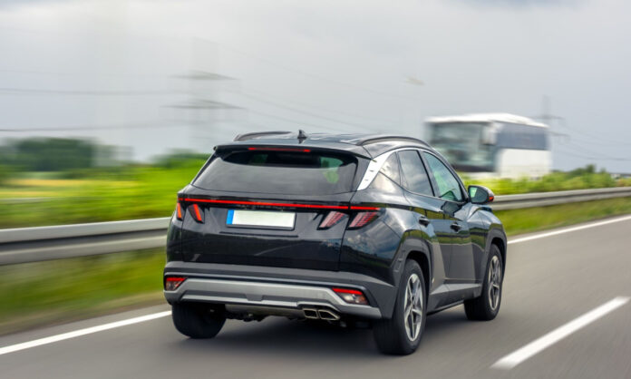 1748411-dcf86017-black-crossover-highway-modern-car-road-driving-summer-road.jpg